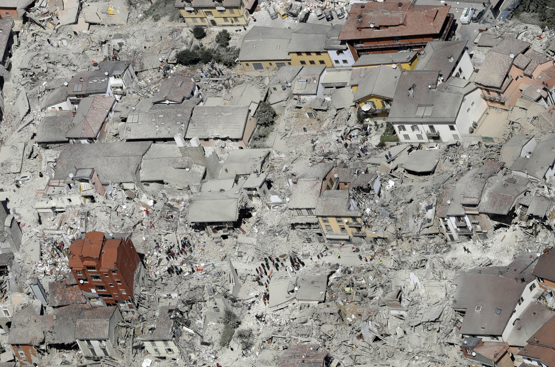 This aerial photo shows the damaged buildings in the town of Amatrice, central Italy, after an earthquake, Wednesday, Aug. 24, 2016. The magnitude 6 quake struck at 3:36 a.m. (0136 GMT) and was felt across a broad swath of central Italy, including Rome where residents of the capital felt a long swaying followed by aftershocks. (AP Photo/Gregorio Borgia)